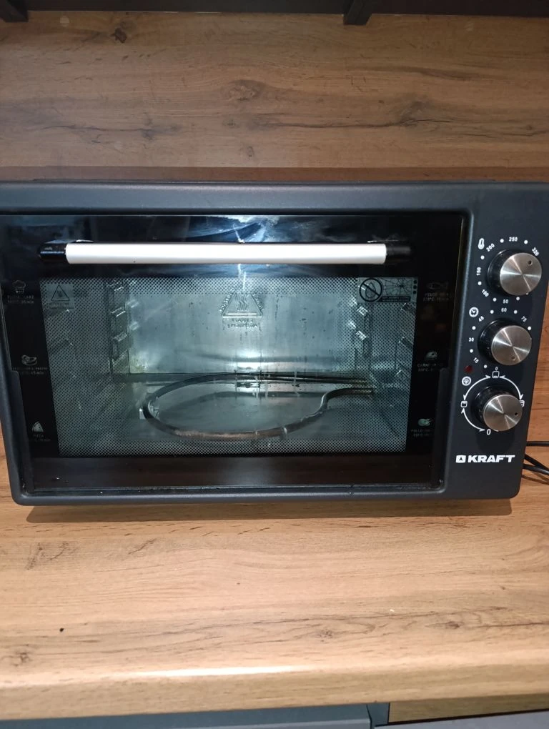 Продам мини печь,   Электропечь Kraft KF-MO3801BL –  Ее объем составляет 38 литров, а мощность 1500 