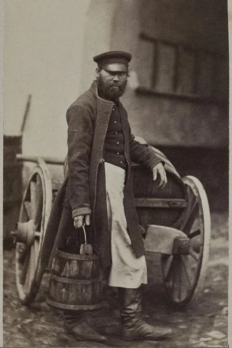 Водонос в Петербурге. 1860-е годы.