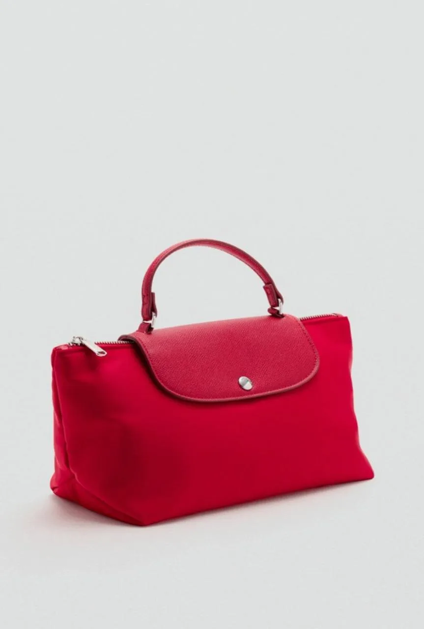 Никогда не понимала культа сумочек Longchamp, но их форму всегда считала достаточно уда...