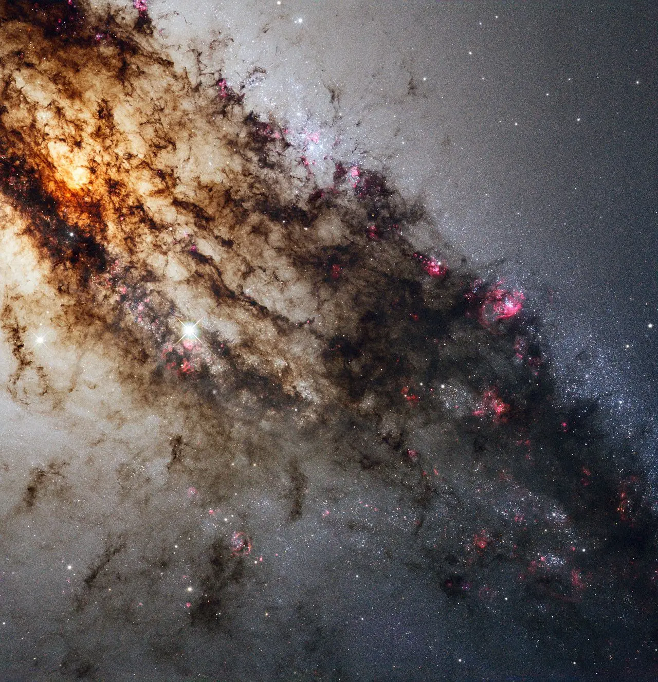Centaurus A, также известная как NGC 5128, хорошо известна своими драматическими пылевыми полосами и
