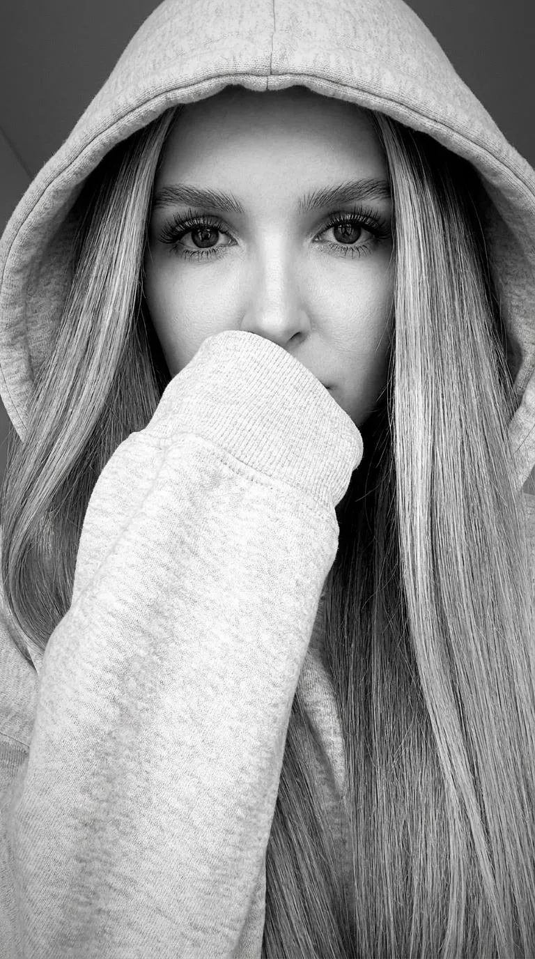 Black and white photography, cinematic aesthetic, intimate close-up selfie shot on a hi...