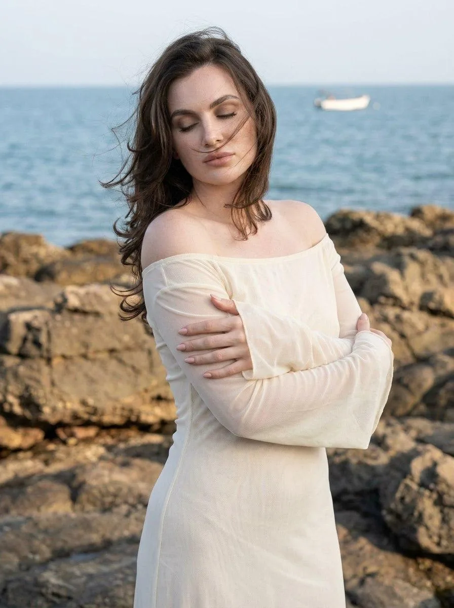 🖼 Woman poses on a rocky shore