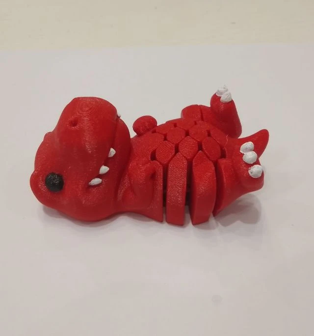 Необычный флекси-динозавр с двигающимся животом. Сделан на 3D принтере. Насыщен деталями.