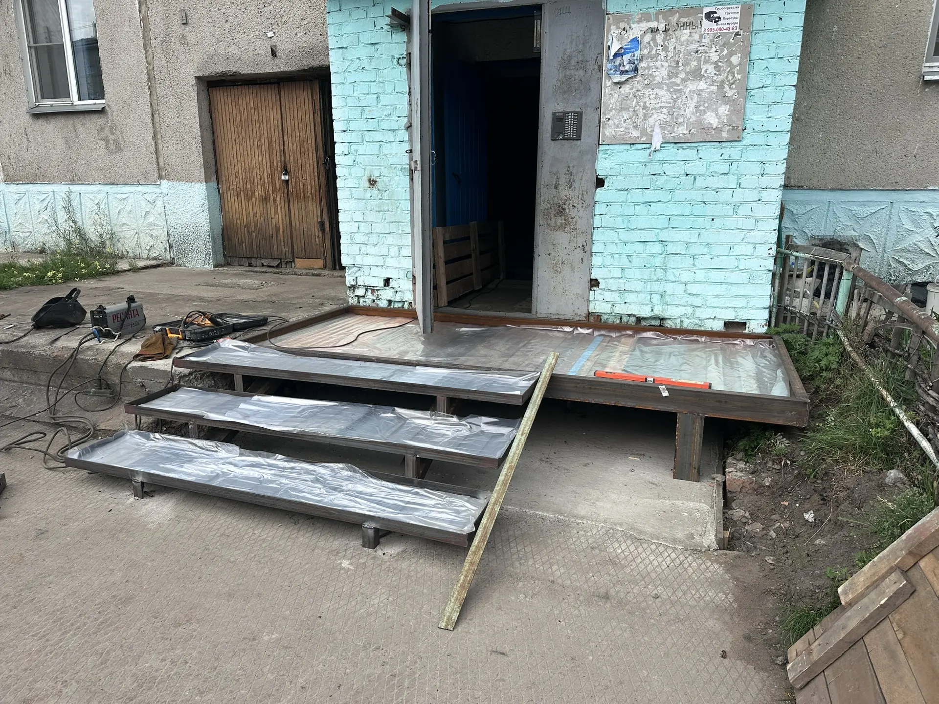 Выполнили демонтаж аварийного крыльца и строительство нового, оборудованного перилами и...